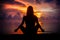 Woman meditating, relaxing in yoga pose at sunset, zen meditation