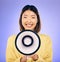 Woman, megaphone and happy portrait in studio for announcement, voice or broadcast. Face of a young asian female speaker