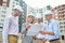 Woman and men looking at drawing at construction site