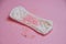 Woman menstrual pad with pink glitters