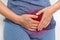 Woman with menstrual pain is holding her aching belly