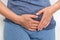 Woman with menstrual pain is holding her aching belly