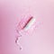 Woman menstrual tampon with pink glitters. Female period hygiene