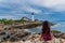 Woman mesmerizing the view of Portland Head Lighthouse in Portland Maine USA