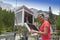 Woman meteorologist reading meteodata in mountain weather station