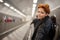 Woman in the metro escalator tunnel