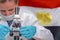 Woman with a microscope against Egypt flag background. Medical technology and pharmaceutical research in Egypt