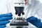 woman microscope biotechnology research laboratory science