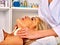 Woman middle-aged take face cleaning in spa salon