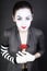 Woman mime with red flower