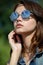 Woman in mirrored sunglasses
