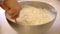 Woman mixes baking ingredients in a bowl