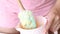 A woman mixes the dough in a container. The process of making Swiss roll. Close-up shot