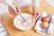 Woman mixing ground flaxseed and flour