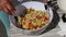 Woman mixing ingredients for homemade tabbouleh