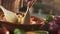 Woman mixing sliced vegetables in a bowl