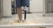 A woman with a modern robotic prosthetic leg is working out in the gym. Physiotherapy rehabilitation that allows a