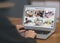 Woman monitoring CCTV cameras at table, closeup. Smart home security system