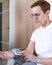 A woman monitors blood pressure on the recommendation of a cardiologist at home. Checks the readings with a hand