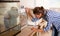 Woman monitors maturation of eggs in an incubator.