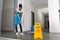 Woman Mopping Corridor