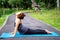 Woman more than 50 year old practicing yoga outdoor location