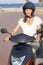 Woman with motor bike in summer