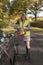 Woman motorist putting out a red reflective safety triangle