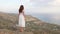 Woman on mountain top looking on sea panorama, Crete