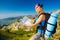 Woman on the mountain watching in map