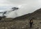 woman mountaineer looking at a mountain landscape