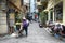 Woman move a bicycle on street