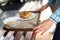 Woman move food tray in self-service restaurant.