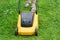 Woman moves with lawnmower