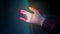Woman moving hand under colorful laser rays - close up view - visuals concept