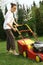 Woman mowing grass