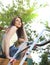 woman mowing grass with lawnmower