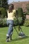 Woman Mowing Lawn