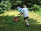 Woman mowing the lawn