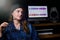 Woman musician sitting in a recording Studio. Portrait of a girl on the recording of a song in the Studio. The singer in place of