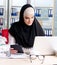 Woman muslim employee working in the office