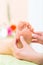 Woman in nail salon receiving foot massage