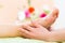 Woman in nail salon receiving foot massage
