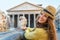 Woman near fountain of the pantheon in rome