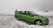 Woman near green Skoda Octavia RS car in Germany