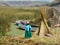 Woman near her family boats at one of the Uros\' islands - Lake Titicaca