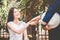 A woman is negotiating a business deal or contracting and business handshake, business partnership meeting concept