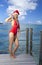 The woman in New Year\'s Santa-Klaus cap on background of sea