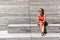 Woman in New York relaxing on bench on High Line