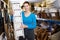 Woman with nightstand with basket in furniture store